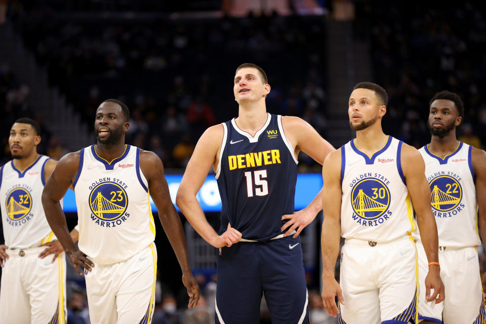 Denver Nuggets star Nikola Jokic towers over Stephen Curry and the talented Golden State Warriors. (Ezra Shaw/Getty Images)