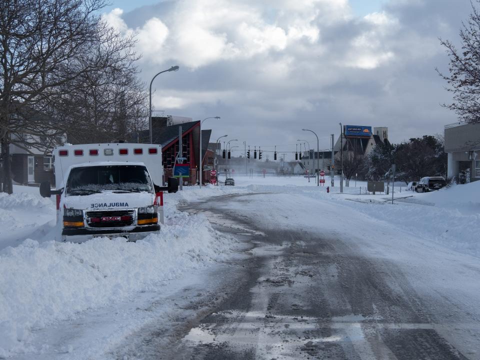 An abandoned ambulance on a roadside after a historic blizzard pummeled Buffalo Sunday, December 25, 2022.