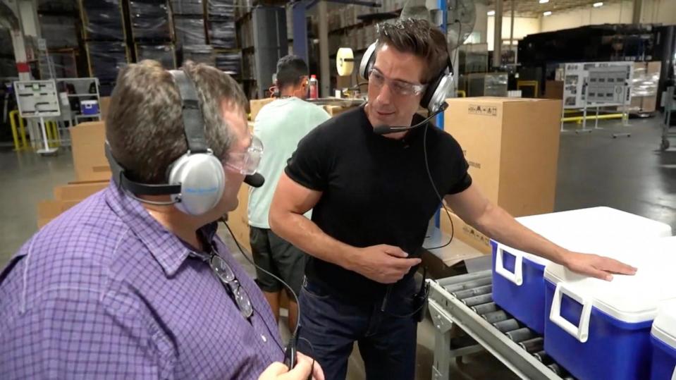 PHOTO: 'World News Tonight' anchor David Muir speaks with Vice President of Operations, Michael Mihelick, at the Igloo Coolers factory in Katy, Texas. (ABC News)