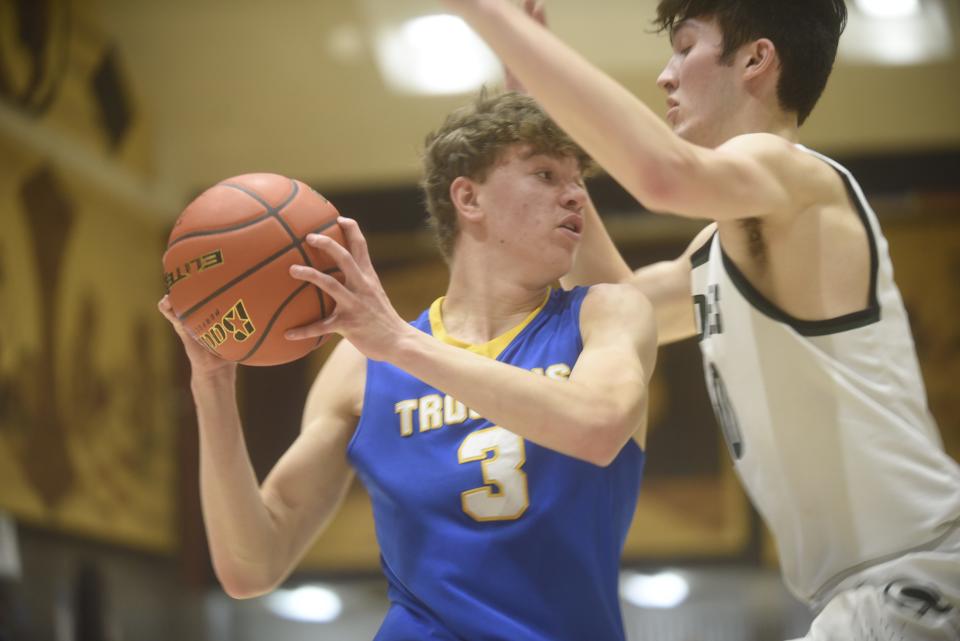 West Central forward Wilson Droge keeps the ball away from a defender against Clark/Willow Lake on Jan. 22, 2022.