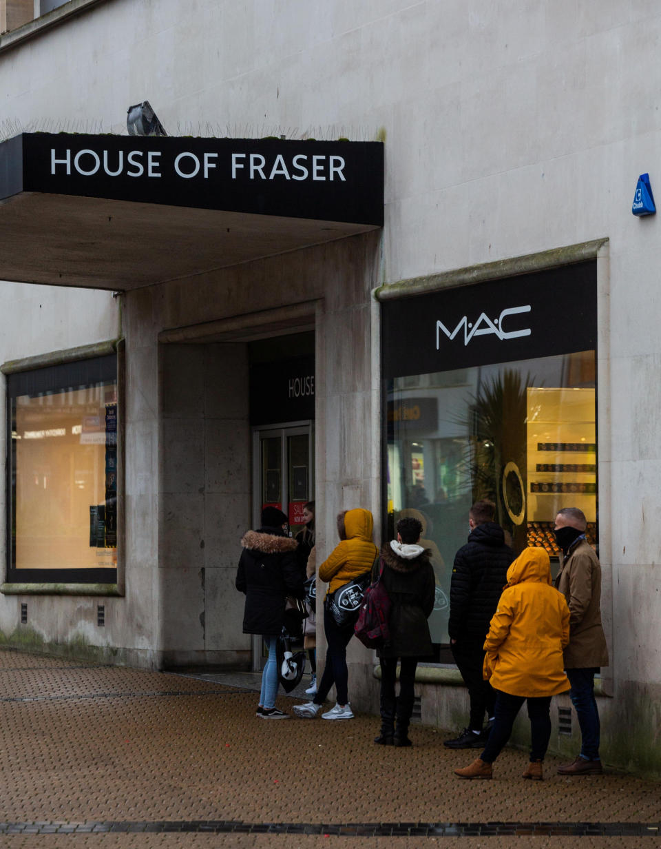 Some  shoppers queue outside of House of Fraser in Plymouth (swns)