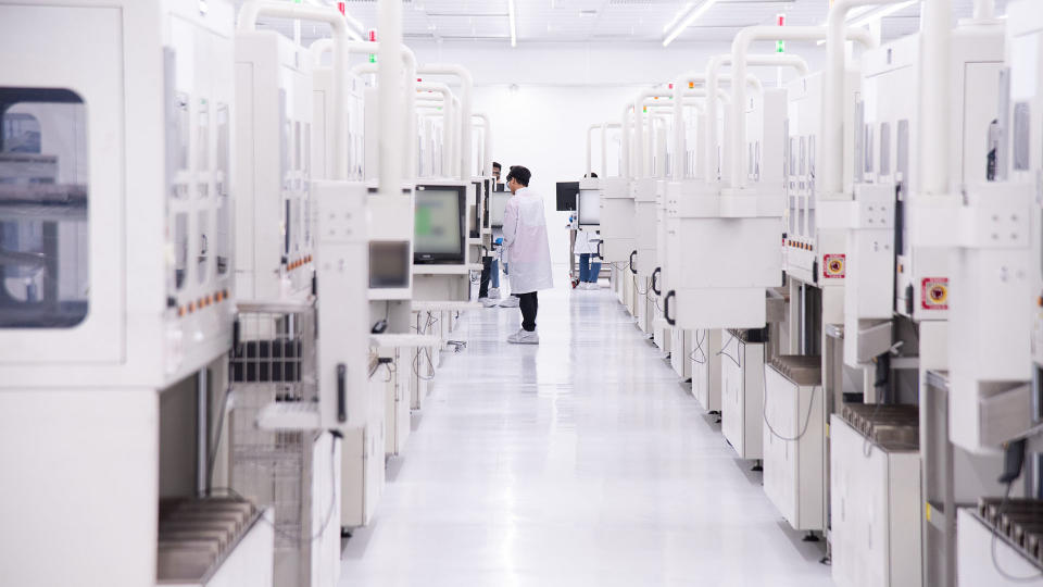 Row after row of machines are used to assemble the millions of chips Intel ships every year