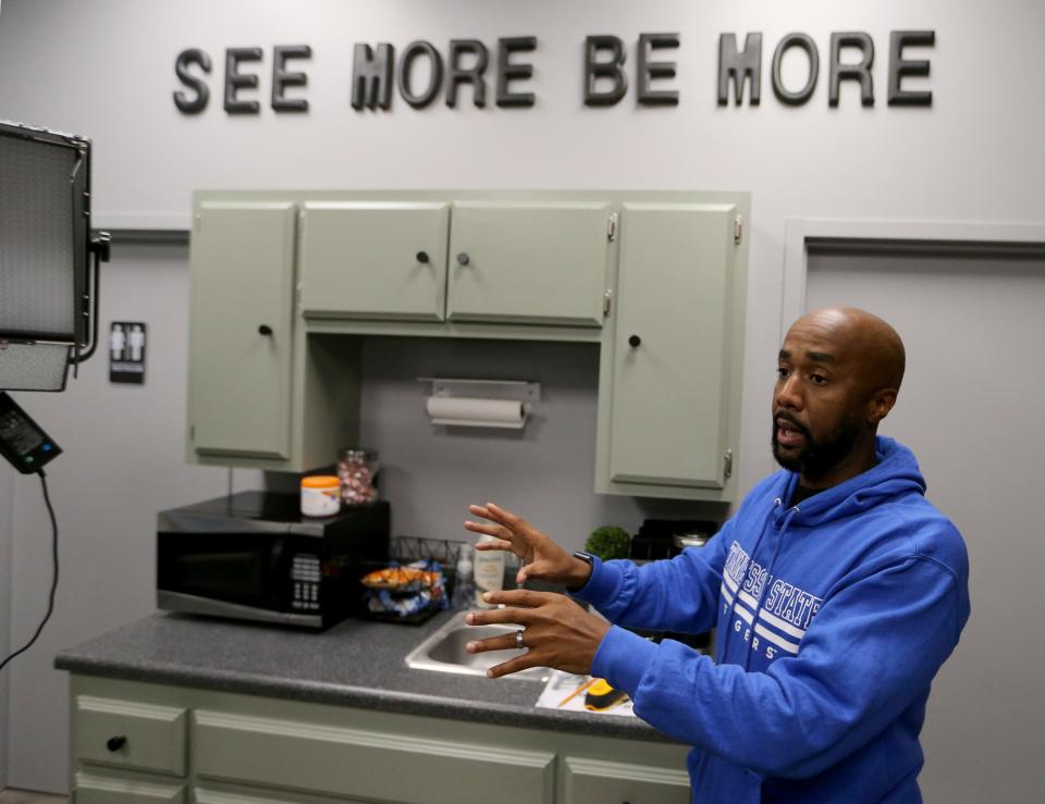 Brian Frazier, 43, a Tennessee State University graduate and resident of South Bend, speaks Monday, Aug. 23, 2023, near the "See More Be More" slogan he invokes when training students on video and fine arts in his studio. Frazier is organizing a series of events as the University of Notre Dame plays Tennessee State on Saturday in a matchup of the Fighting Irish and a Historically Black College or University. The events will include a TSU pep rally Friday at Jon R. Hunt Plaza and meetings with high school students and alumni from HBCUs.