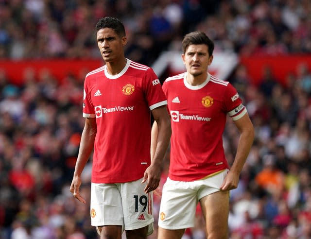 Raphael Varane (left) and Harry Maguire in action