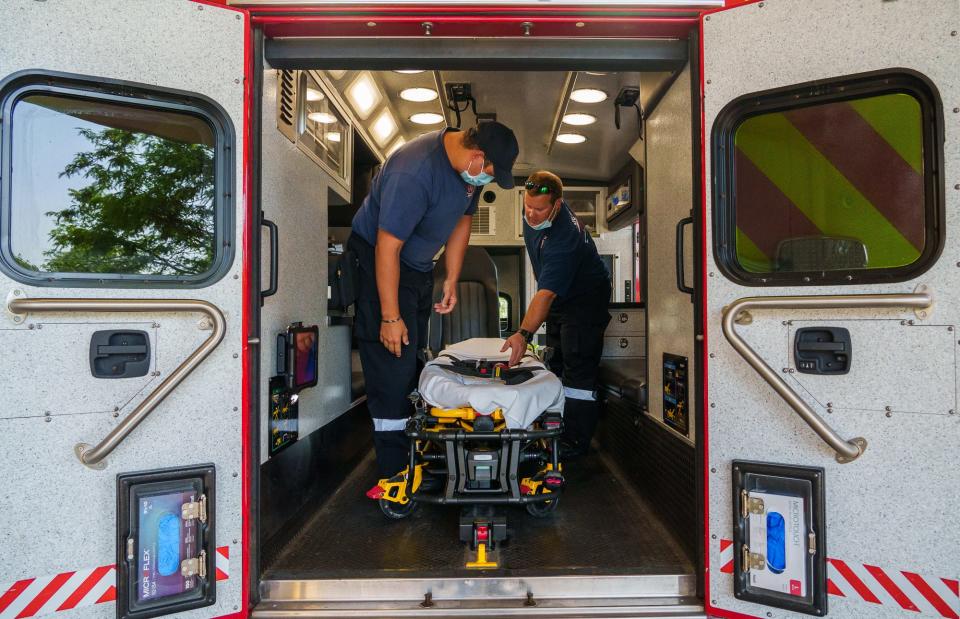 Westfield Fire Department EMT Clint Garrard (right) and paramedic Josh Brown clean up the inside of their ambulance Thursday, July 21, 2022, after a sick female run and transfer to a Carmel hospital. "There's been multiple times that we leave here and before we make it back to the station we'll get another run," Garrard said. "We try to have it ready so we don't arrive with a mess."