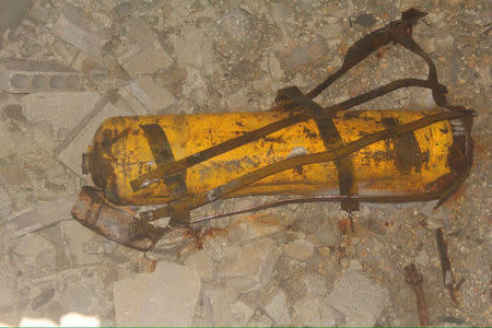 Handout photo provided to Reuters on February 13, 2017, by Human Rights Watch claiming to show remnant of yellow gas cylinder found in Masaken Hanano, Aleppo, Syria after a chlorine attack on November 18, 2016. Courtesy of Human Rights Watch/Handout via REUTERS