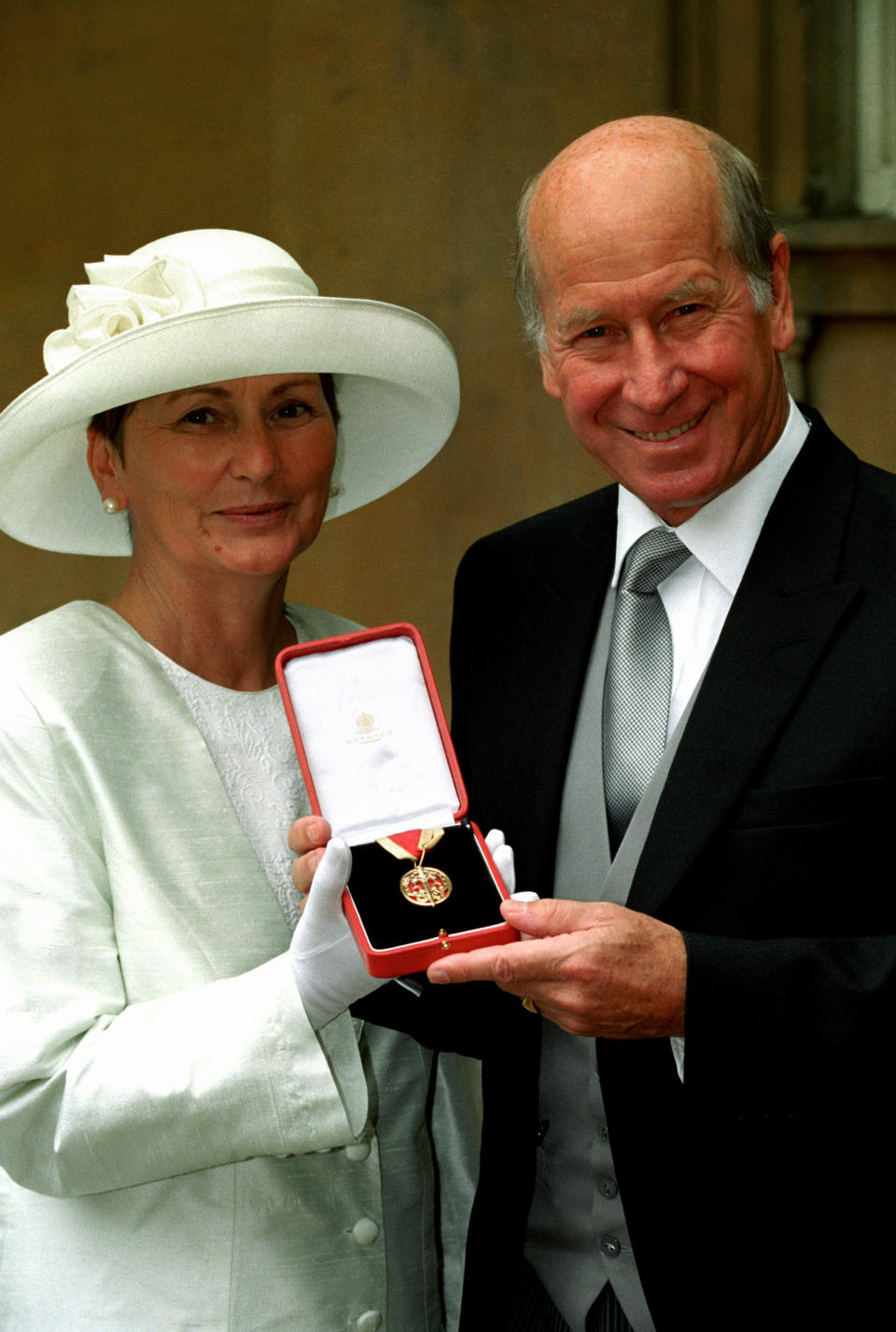 Bobby Charlton with his Knighthood in 1994