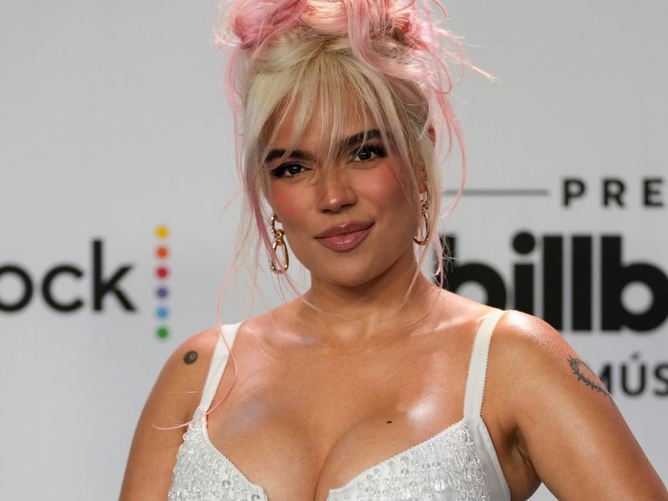 Colombian singer Karol G poses on the blue carpet at the Latin Billboard Awards, in Coral Gables, Fla., Thursday, Oct. 5, 2023.