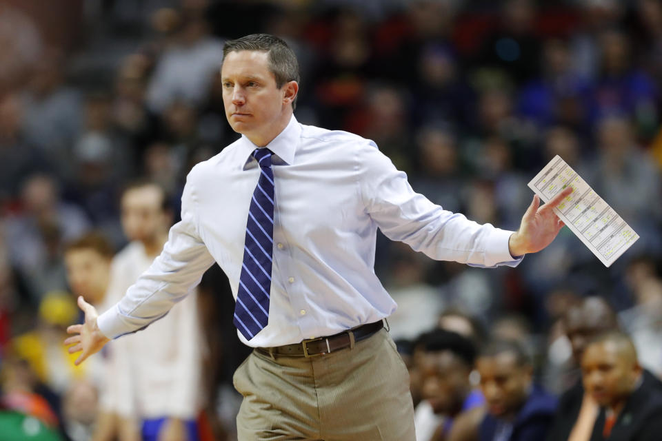 Florida head coach Mike White directs his team during a first round men's college basketball game against Nevada in the NCAA Tournament, Thursday, March 21, 2019, in Des Moines, Iowa. (AP Photo/Charlie Neibergall)