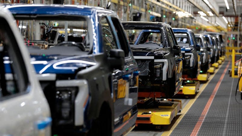 A photo of Ford F-150 Lightning trucks on the production line. 