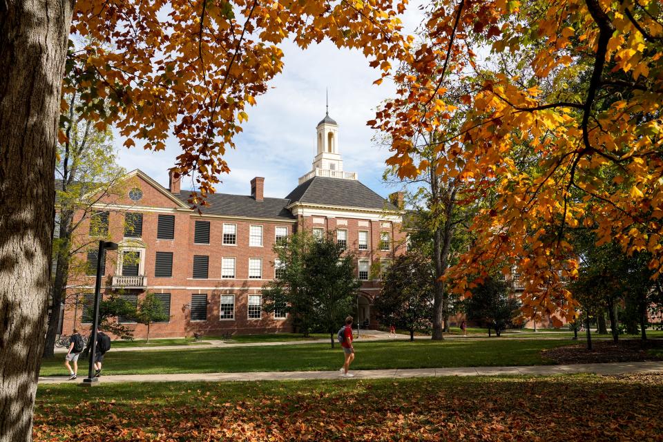 Students walk to and from class along sidewalks in front of Upham Hall on Wednesday, Oct. 4, 2023, at Miami University campus in Oxford, Ohio.