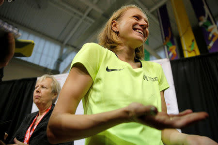 Russian whistleblower and runner Yulia Stepanova, who helped expose massive doping problems in Russia that led to the country's track and field team being banned from international competition, talks to reporters after competing as a neutral athlete in the 800 meter race at the Boston Indoor Grand Prix in Boston, Massachusetts, U.S. January 28, 2017. REUTERS/Brian Snyder