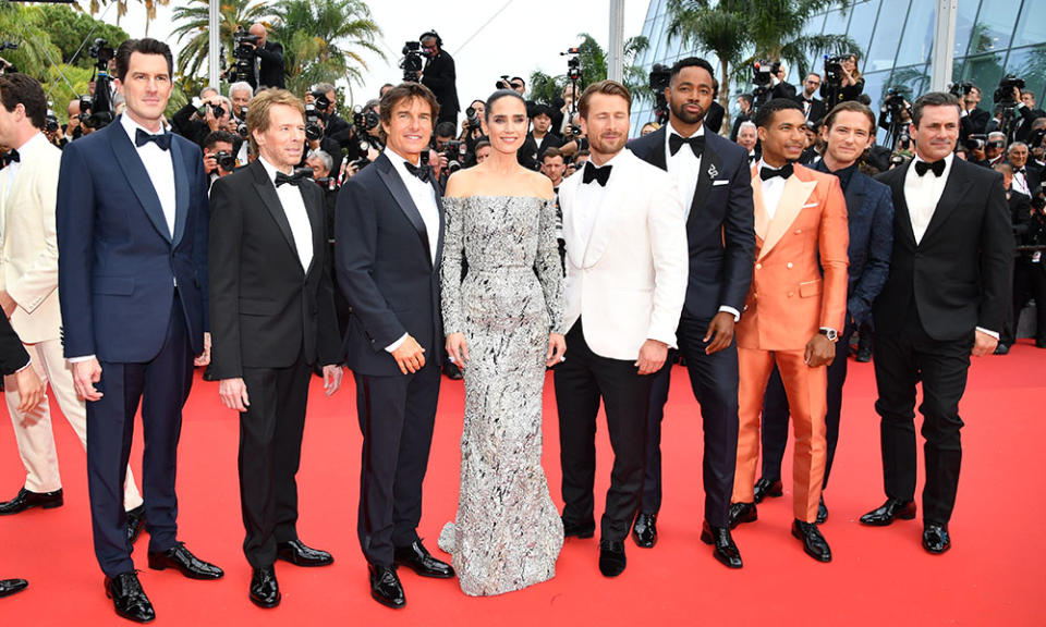 Joseph Kosinski, Jerry Bruckheimer, Tom Cruise, Jennifer Connelly, Glen Powell, Jay Ellis, Greg Tarzan Davis, Lewis Pullman and Jon Hamm attend the screening of Top Gun: Maverick during the 75th annual Cannes film festival at Palais des Festivals on May 18, 2022, in Cannes. - Credit: Dominique Charriau/WireImage