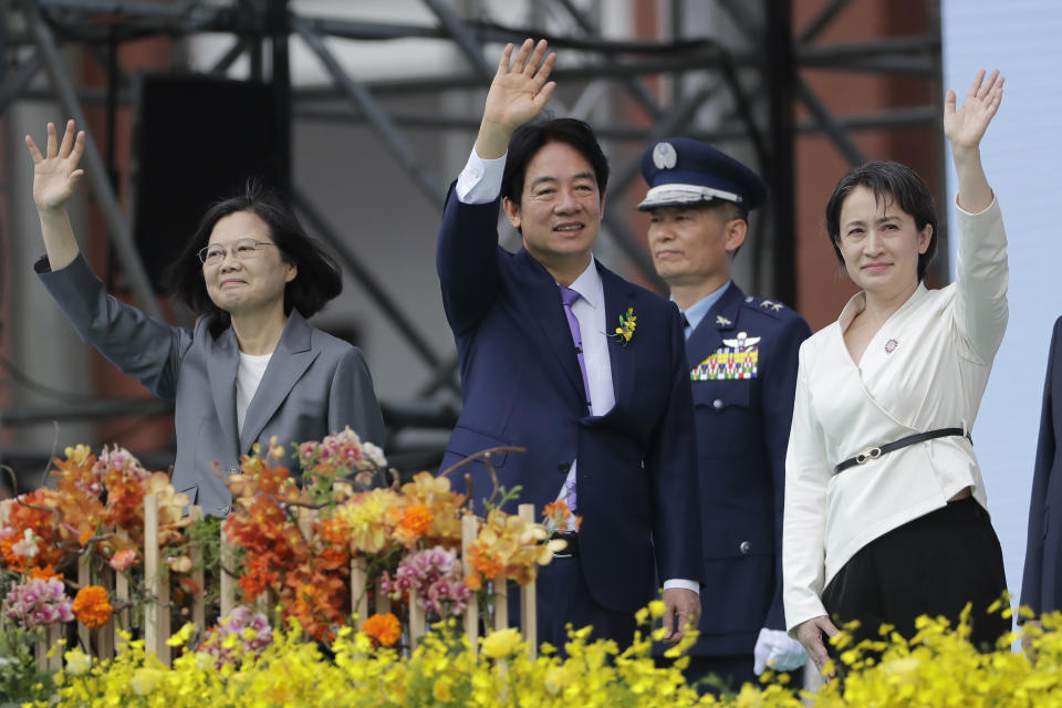 New Taiwan's President Lai Ching-te, center, Vice President Hsiao Bi-khim, right, and former President Tsai Ing-wen wave during Lai's inauguration ceremonies in Taipei, Taiwan, Monday, May 20, 2024. (AP Photo/Chiang Ying-ying)