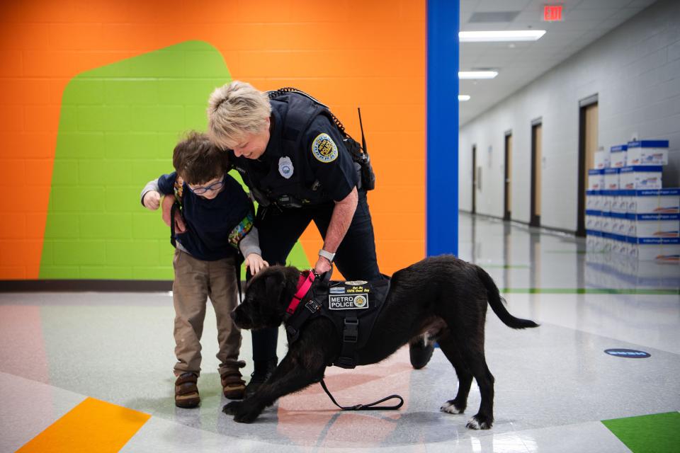 Asher Wade is greets Sgt. Bo and Officer Faye Okert in the morning before heading to class at Goodlettsville Elementary School in Goodlettsville, Tenn., Thursday, Jan. 25, 2024.