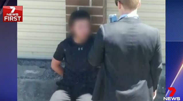 An investigator appeared to record the arrest on a mobile phone. Photo: 7 News/Supplied