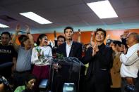 Thailand's opposition Future Forward Party leader Thanathorn Juangroongruangkit reacts after hearing the verdict from the Constitutional Court