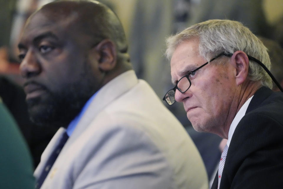 Mississippi House Medicaid Committee members Reps. Jeffrey Hulum III, D-Gulfport, left, and Randy Boyd, R-Mantachie, listen as representatives from the Hilltop Institute, a nonpartisan research organization, present a brief on the economic impact of Medicaid expansion in Mississippi, to the committee, media and lobbyists at the state Capitol in Jackson, Miss., Tuesday, Feb. 20, 2024. (AP Photo/Rogelio V. Solis)