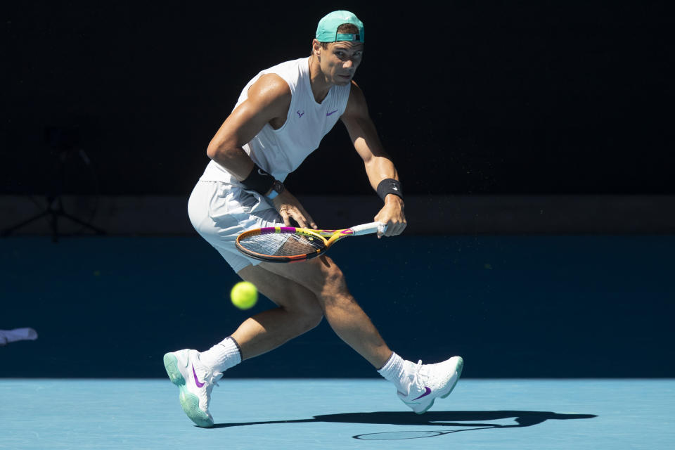 Spain's Rafael Nadal hits a return during practice on Rod Laver Area ahead of the Australian Open tennis championships on Sunday, Jan. 16, 2022, in Melbourne, Australia. (AP Photo/Simon Baker)