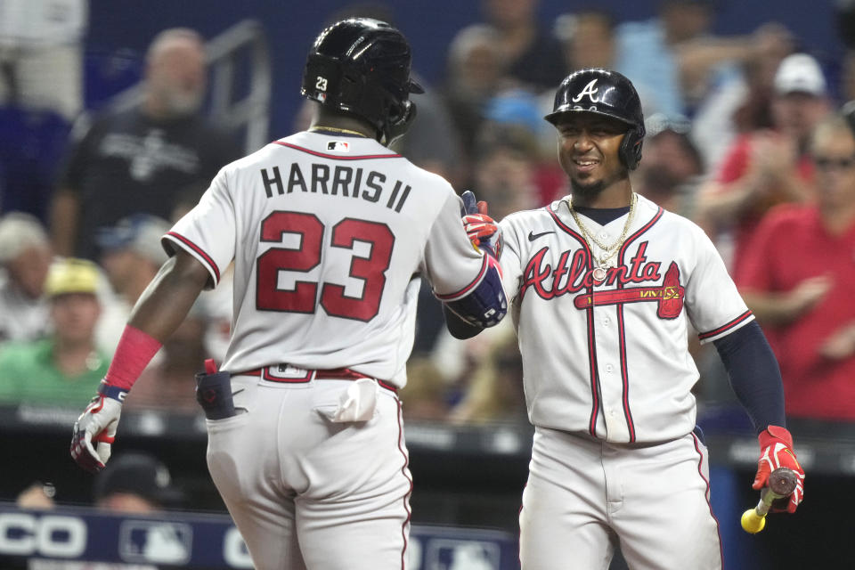 Atlanta Braves' Michael Harris II (23) is met by Ozzie Albies after hitting a solo home run during the fifth inning of a baseball game against the Miami Marlins, Saturday, Sept. 16, 2023, in Miami. (AP Photo/Lynne Sladky)