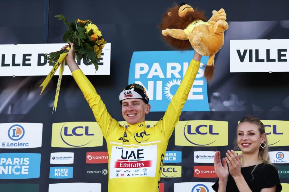 Overall winner UAE Team Emirates Slovenian rider Tadej Pogacar C wearing the overall leaders yellow jersey celebrates on the podium after winning the 8th and final stage of the 81st Paris  Nice cycling race 1175 km between Nice and Nice in French riviera city of Nice southeastern France on March 12 2023  Slovenias Tadej Pogacar wins ParisNice title after winning the final stage on March 12 2023 Photo by AnneChristine POUJOULAT  AFP Photo by ANNECHRISTINE POUJOULATAFP via Getty Images