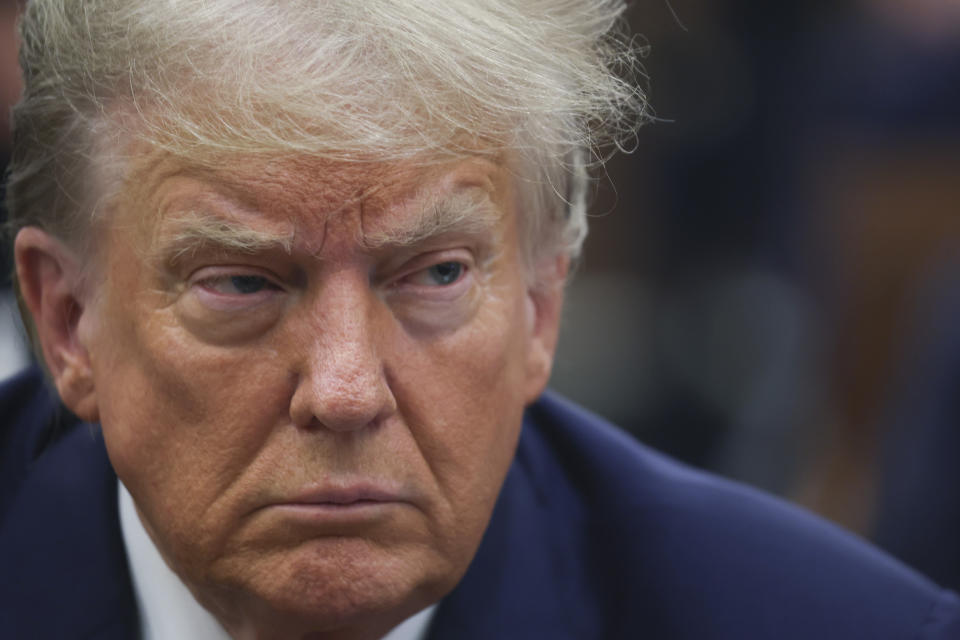 Former President Donald Trump sits in court for a civil fraud case at a Manhattan courthouse, in New York, Tuesday, Oct. 3, 2023. (Shannon Stapleton/Pool Photo via AP)