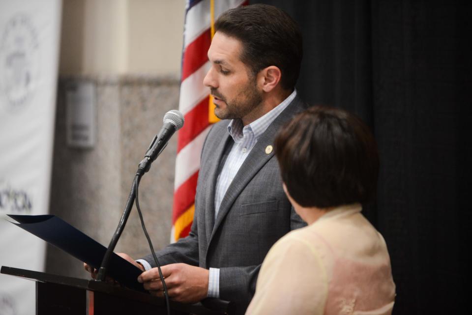 Jackson Mayor Scott Conger reads off a proclamation honoring AAPI month during the AAPI Heritage Month celebration inside Jackson City Hall on Friday, May 3, 2024.