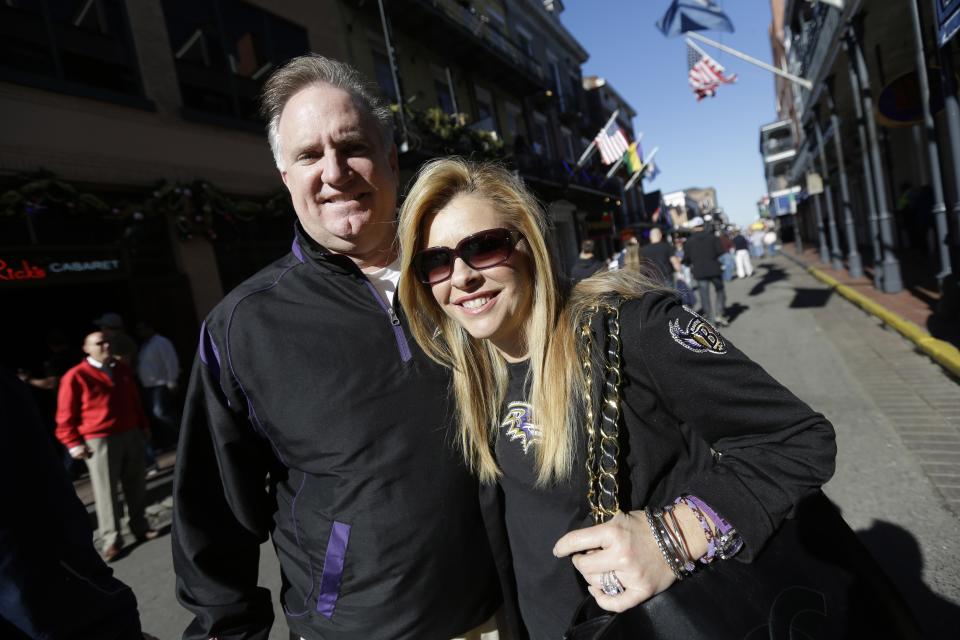 In this Friday, Feb. 1, 2013 photo, Sean and Leigh Anne Tuohy, adoptive parents of Baltimore Ravens starting offensive lineman Michael Oher, stand on a street in New Orleans. They were depicted in the move 