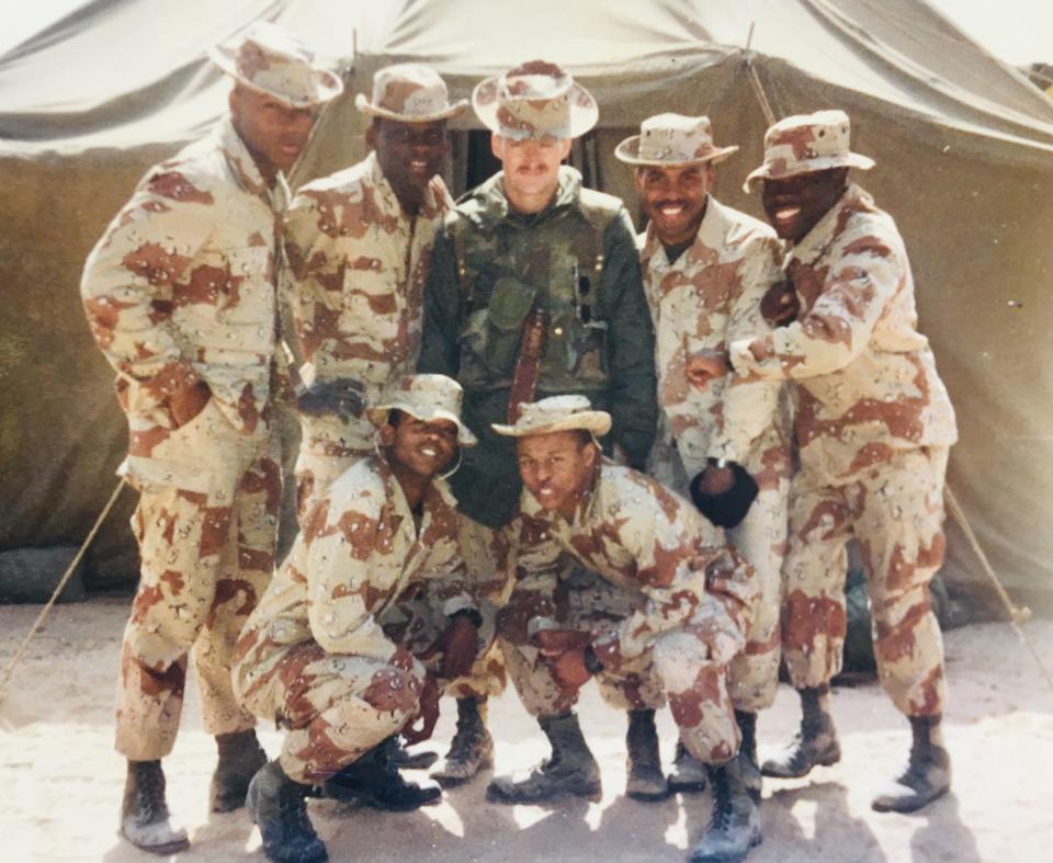 Brian O'Hare, center green fatigues, while deployed with fellow Marines during the Persian Gulf War. (Brian O'Hare)