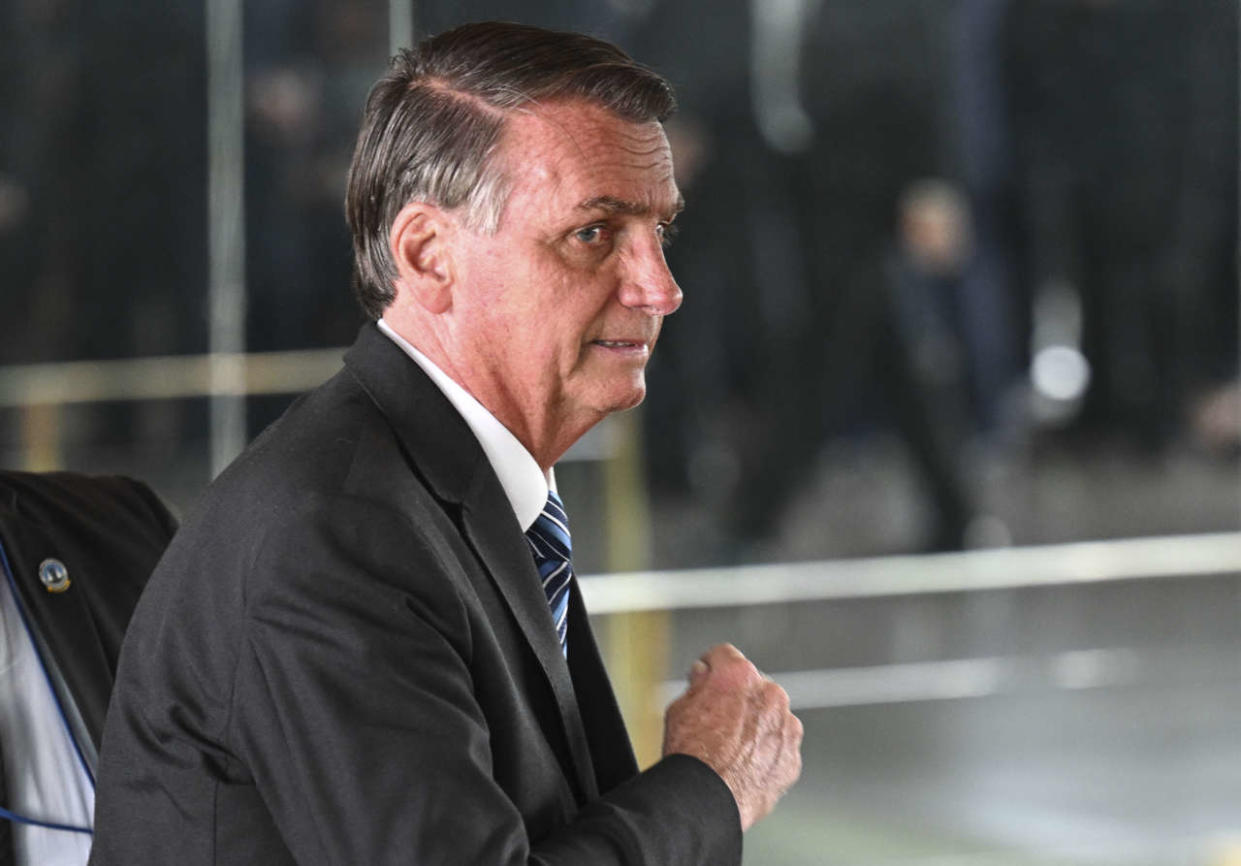 (FILES) In this file photo taken on November 01, 2022, Brazilian President Jair Bolsonaro leaves after making a statement for the first time since Sunday's presidential run-off election, at Alvorada Palace in Brasilia. - Since losing his reelection bid, outgoing Brazilian President Jair Bolsonaro has virtually disappeared from view, holing up in his official residence -- and leaving the country with the uneasy feeling of a power vacuum. (Photo by EVARISTO SA / AFP)