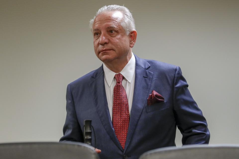 Carmen Puliafito, in suit and tie, at a state medical board trial.