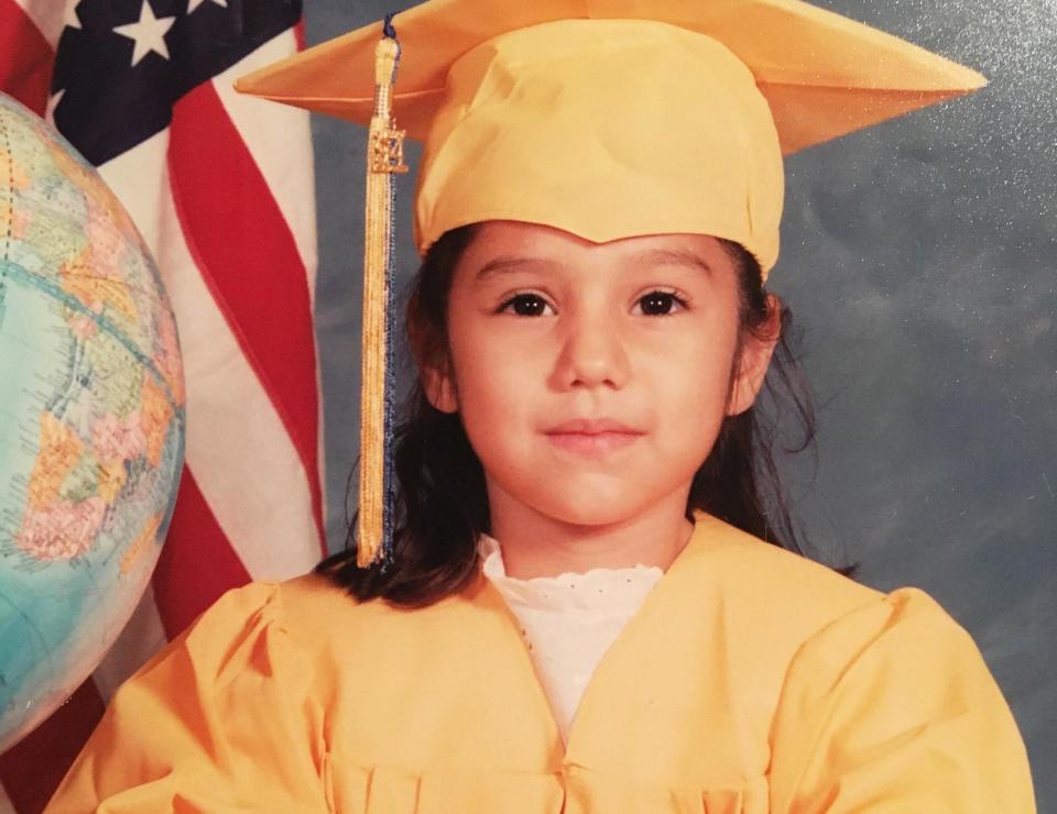 Norma, age 5, poses for her kindergarten graduation photo. (Photo: COURTESY OF NORMA HERRERA)