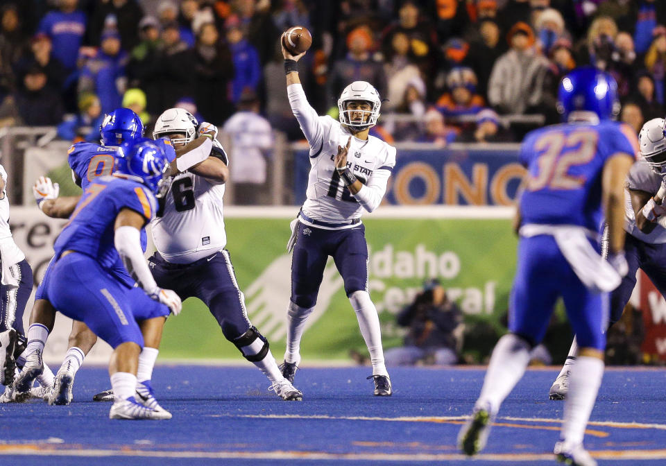 Utah State QB Jordan Love has 3,208 yards and 28 touchdowns this season. (AP Photo/Steve Conner)
