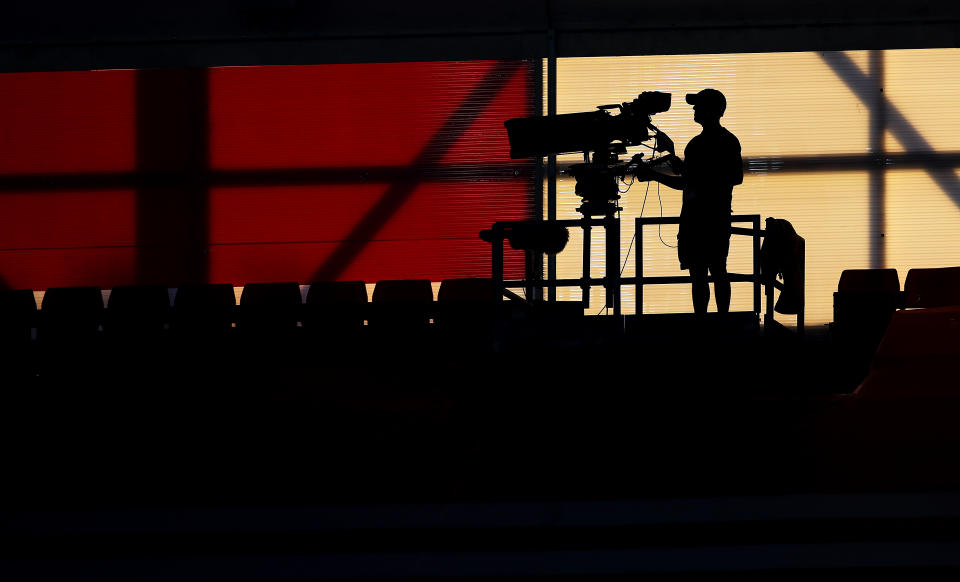 SOUTHAMPTON, ENGLAND - JULY 16: A TV camera operator works during the Premier League match between Southampton FC and Brighton & Hove Albion at St Mary's Stadium on July 16, 2020 in Southampton, United Kingdom. Football Stadiums around Europe remain empty due to the Coronavirus Pandemic as Government social distancing laws prohibit fans inside venues resulting in all fixtures being played behind closed doors. (Photo by Matt Watson/Southampton FC via Getty Images)