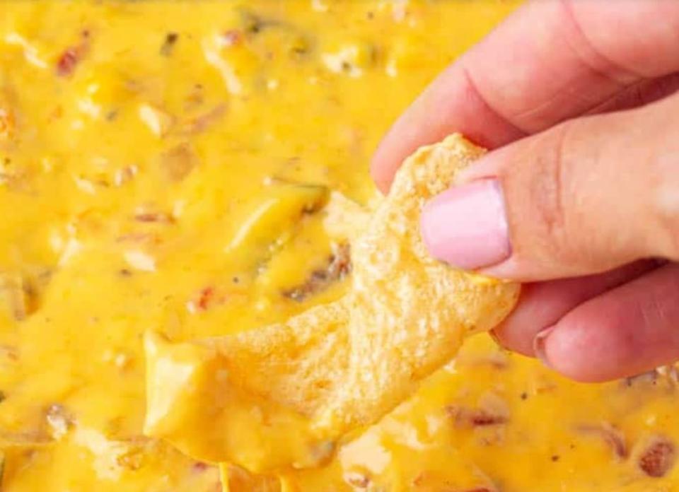 <p>Midget Momma</p><p>Pop all the ingredients in an aluminum tray and set them in a grill or smoker. It’s no wonder this is a viral sensation since it’s so easy!</p><p><strong>Get the recipe: <a href="https://www.midgetmomma.com/smoked-queso-dip-the-best-velveeta-queso-dip/" rel="nofollow noopener" target="_blank" data-ylk="slk:Smoked Queso Dip;elm:context_link;itc:0;sec:content-canvas" class="link ">Smoked Queso Dip</a></strong></p><p><strong>Related: <a href="https://www.yahoo.com/lifestyle/90-super-bowl-worthy-dips-223419416.html" data-ylk="slk:70 Best Super Bowl Dips;elm:context_link;itc:0;sec:content-canvas;outcm:mb_qualified_link;_E:mb_qualified_link;ct:story;" class="link  yahoo-link">70 Best Super Bowl Dips</a></strong></p>