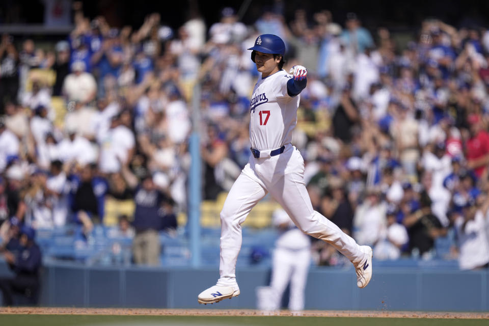 Los Angeles Dodgers' Shohei Ohtani celebrates after hitting a walk-off single during the 10th inning of a baseball game against the Cincinnati Reds Sunday, May 19, 2024, in Los Angeles. The Dodgers won 3-2. (AP Photo/Mark J. Terrill)