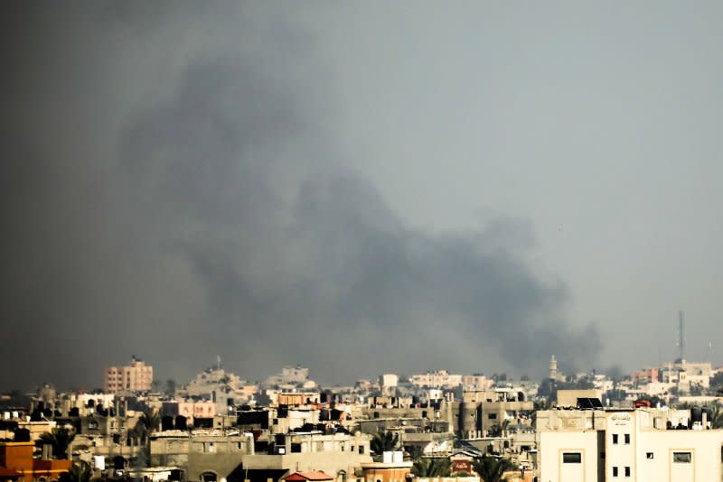 Smoke rises above Khan Younis in the southern Gaza Strip following Israeli bombardment on Monday, a day after Israel Defense Forces said it was withdrawing five brigades from the frontline, marking a new phase in the war against Hamas. Photo by Ismael Mohamad/UPI