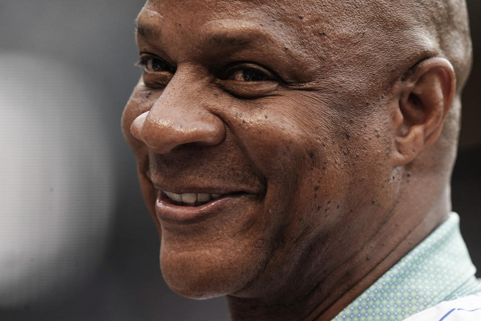 Former New York Mets player Darryl Strawberry smiles while talking to fans before a baseball game against the New York Yankees Tuesday, July 26, 2022, in New York. (AP Photo/Frank Franklin II)