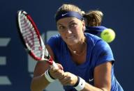 Petra Kvitova of the Czech Republic hits a return to Kristina Mladenovic of France during their match at the 2014 U.S. Open tennis tournament in New York, August 26, 2014. REUTERS/Adam Hunger