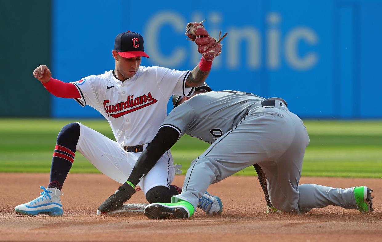 Guardians shortstop Brayan Rocchio fails to tag Chicago White Sox third baseman Yoán Moncada, who stole second during the first inning of the home opener, Monday, April 8, 2024.
