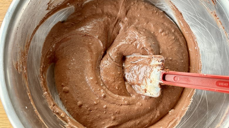 stirring chocolate batter in bowl