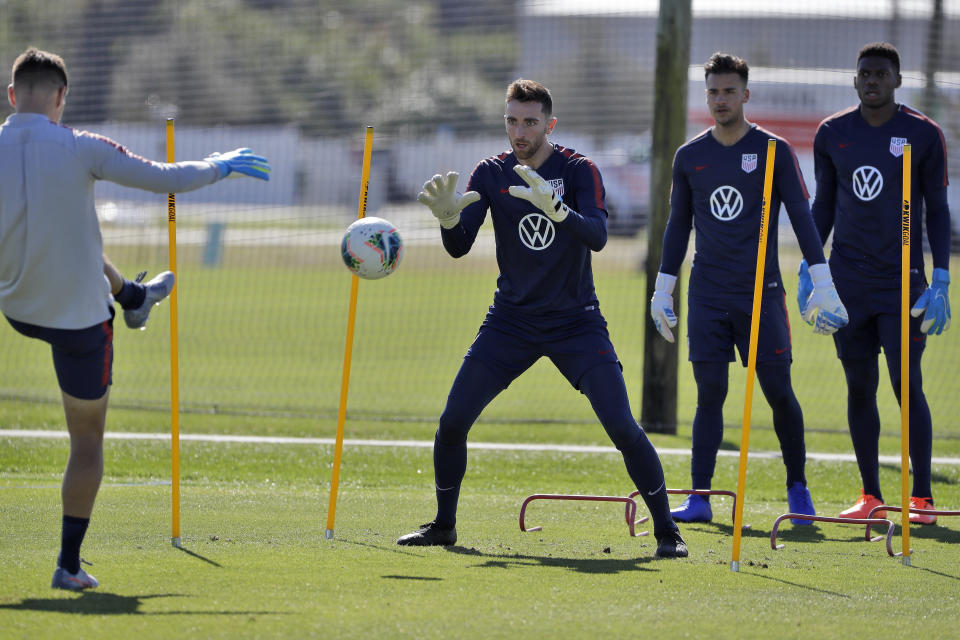 Goalkeepers Matt Turner, center, JT Marcinkowski, second from right, and Sean Johnson, right, of the U.S. Men's National Soccer team, train Wednesday, Jan. 8, 2020, in Bradenton, Fla. The team moved its training camp from Qatar to Florida in the wake of Iran's top military commander being killed during a U.S. airstrike in the Middle East. (AP Photo/Chris O'Meara)