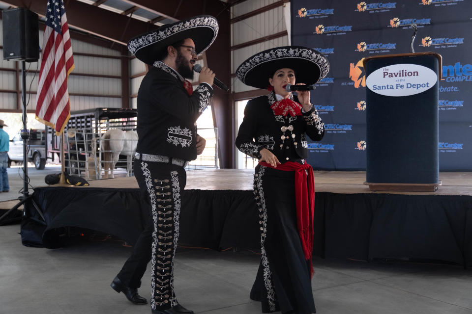 Mariachi singers Karen and Javier perform Friday at the grand opening of the Pavilion at the Santa Fe Depot in downtown Amarillo.