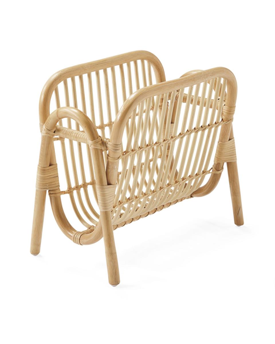 <p><strong>SERENA & LILY</strong></p><p>serenaandlily.com</p><p><strong>$348.00</strong></p><p>There's no such thing as midcentury modern flair, especially when it leans towards tiki. This beautiful wicker magazine holder is an understated design marvel, with sturdy handles and a see-through build that allows you to check out the periodicals you might want to read before even grabbing them. Genius.</p>