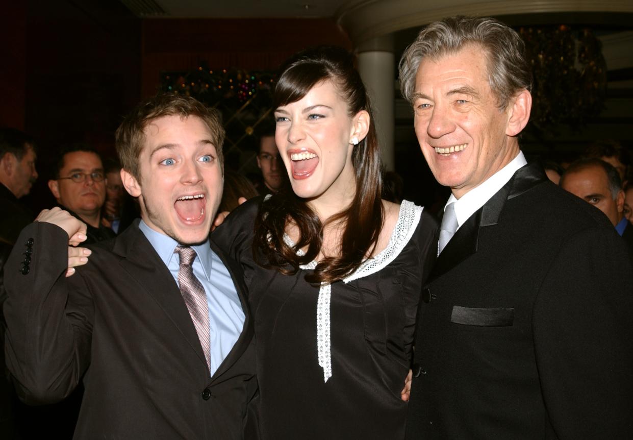 UNITED STATES - DECEMBER 13:  Elijah Wood, Liv Tyler and Ian McKellen (l. to r.) whoop it up at the pre-screening party for the movie 