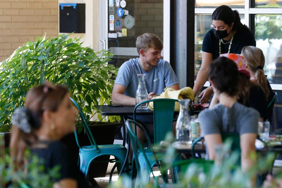 Customers enjoy lunch at Heirloom Café on the restaurant's 10 year anniversary in Athens, Ga., on Thursday, June 17, 2021.