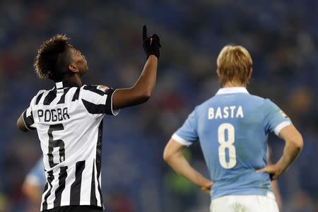 Juventus' Paul Pogba (L) celebrates after scoring his second goal against Lazio during their Italian Serie A soccer match at Olympic stadium in Rome November 22, 2014. REUTERS/Giampiero Sposito