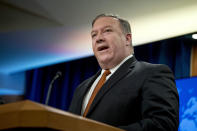 Secretary of State Mike Pompeo speaks at a news conference in the press briefing room at the State Department in Washington, Friday, Sept. 14, 2018, in Washington. Pompeo says his Obama-era predecessor John Kerry has been 'actively undermining' U.S. policy on Iran. (AP Photo/Andrew Harnik)