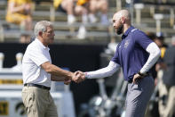 Iowa head coach Kirk Ferentz, left, greets Kent State head coach Sean Lewis before an NCAA college football game, Saturday, Sept. 18, 2021, in Iowa City, Iowa. (AP Photo/Charlie Neibergall)