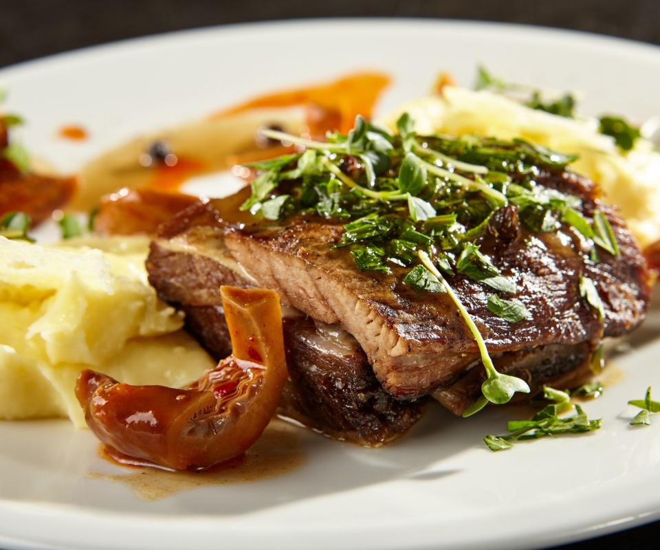 slowcooker brisket with mash potato, herbs, and forest mushrooms